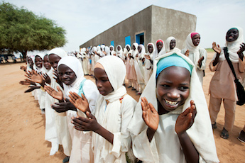 Girls in Kuma Garadayat, North Darfur, celebrate the inauguration of their new school as part of the six development projects in the areas of education, sanitation, health, community development and women empowerment. Photo by Albert González Farran - UNAMID