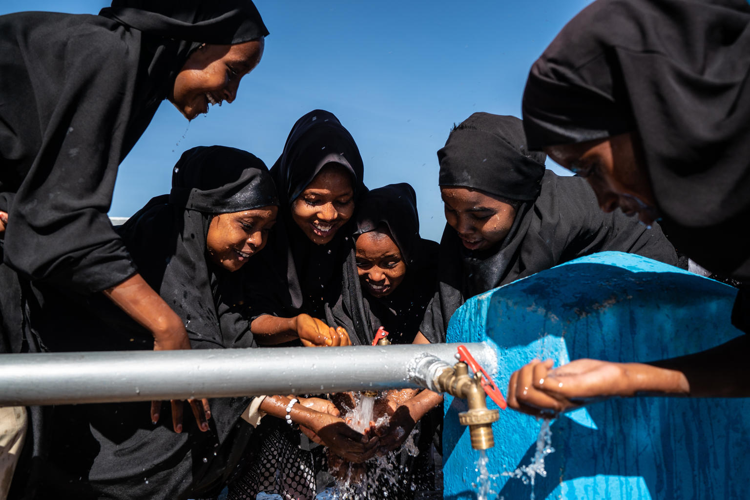 Young girls wash their hands at an EU-funded, UNICEF-supported water point in Tog-wajaale, Somaliland, Sunday, December 2, 2018. The clean and sustainable water system is the town's first ever and provides clean water for 70,000 people. Mackenzie Knowles-Coursin/UNICEF Hand hygiene must be recognized as a fundamental behaviour.