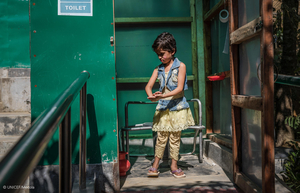 Rajuma, 6, uses a disability-friendly latrine in a learning centre in Camp 16, Balukhali refugee camp in Cox’s Bazar, Bangladesh, November 14, 2019. Rajuma was born with weak knees that keep her from walking far, or to stand for too long. She cannot run at all. She loves attending the learning centre, but she needs help from her friend Meena to walk there every day. Rajuma loves to learn rhymes and enjoys singing “the Banana song”.