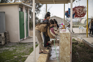 On 8 March 2022 in Iraq, Yazidi girls wash their hands a child-friendly space in Shekhan camp for internally displaced persons (IDPs). Child-friendly spaces help children in Iraq to overcome the impact of conflict by providing them with opportunities to heal the scars of war in a safe and secure environment.